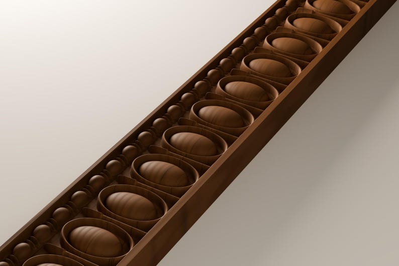 May include: A long, linear wooden moulding strip featuring a repeating pattern of raised, smooth, oval-shaped centres framed by thin, rounded borders, flanked by a continuous row of small, spherical wooden beads along one side.