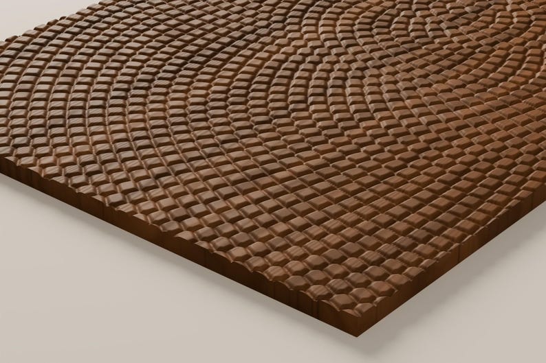Puede incluir: Un panel rectangular de madera con una superficie texturizada compuesta por numerosos bloques cuadrados peque&ntilde;os y elevados, dispuestos en un patr&oacute;n ondulado y curvo que se repite por toda la cara de la pieza de madera marr&oacute;n.