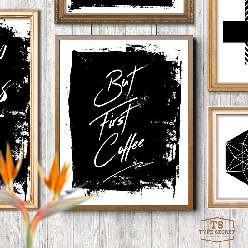 May include: Black and white typography print with the text "But First Coffee" in a handwritten style. The text is on a black background with a white distressed paint effect.