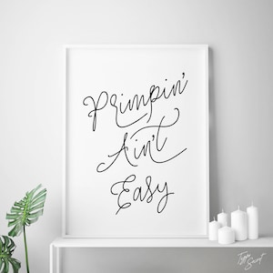 May include: Black and white printable wall art with the text "Primpin' Ain't Easy" in a handwritten script font.