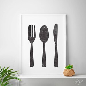 May include: Black and white print of a fork, spoon, and knife on a white background. The print is framed in a white frame.