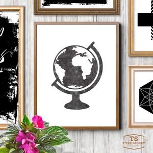 May include: A black and white printable art print featuring a vintage globe illustration. The globe is a simple silhouette with a textured look. The print is perfect for a minimalist or modern home decor style.