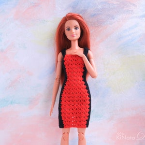 May include: A red and black crochet dress for a doll. The dress has a fitted silhouette and a scoop neckline.