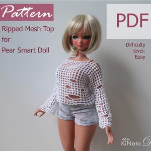 May include: A white, ripped mesh top for a Pear Smart Doll. The image includes the text "Pattern" and "PDF". The difficulty level is listed as "Easy". The doll is wearing denim shorts and has blonde hair.