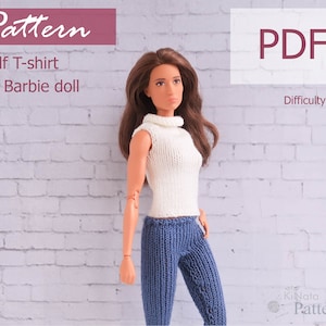 May include: A doll wearing a white knitted golf t-shirt and blue knitted pants. The image includes the text "Pattern", "Golf T-shirt for Barbie doll", "PDF", and "Difficulty level: Easy". The doll has long brown hair and is posed against a white brick wall.