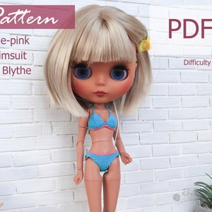 May include: A crochet pattern for a blue and pink swimsuit for a Blythe doll. The pattern is labeled "Easy" in difficulty level. The pattern is available as a PDF download.