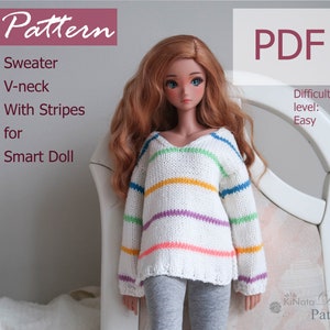 May include: A PDF pattern for a white sweater with colourful stripes, designed for a Smart Doll. The sweater has a V-neck and is described as easy to knit. The pattern is titled "Pattern" and "KiNata Dolls Pattern" is visible in the bottom right corner.
