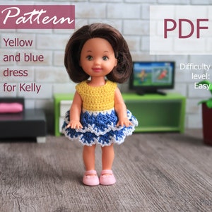 May include: A crochet doll dress pattern for Kelly dolls. The dress is yellow and blue with white trim. The pattern is easy to follow and includes instructions for making the dress. The pattern is available as a PDF download. Difficulty level: Easy.