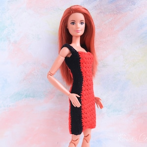 May include: A red and black crocheted dress for a doll. The dress has a black stripe down the side and a red crocheted bodice.