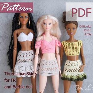 May include: Three crochet lace skirts for FR and Barbie dolls. The skirts are in white, grey, and yellow with green accents. The pattern is for an easy crochet project.