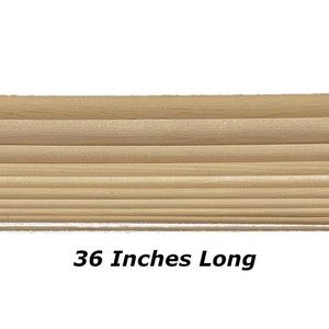 May include: A set of 10 wooden dowels, each 36 inches long. The dowels are arranged in a stack, with the largest dowel at the bottom and the smallest dowel at the top.  36 Inches Long
