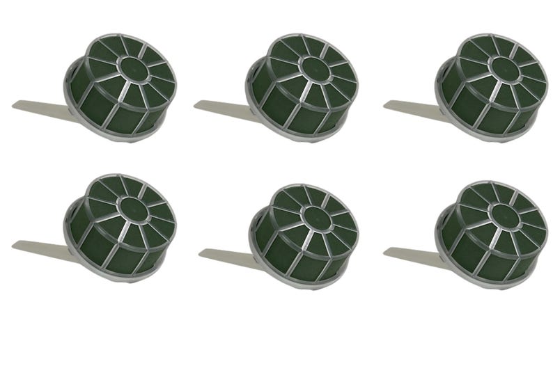 May include: A set of six circular floral foam cages with dark green foam inserts encased in a silver-colored plastic grid frame. Each unit features a small, flat, protruding handle extending from the side of the circular base for mounting.