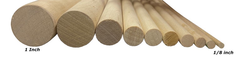 May include: A set of 10 wooden dowels in various sizes, ranging from 1 inch to 1/8 inch in diameter. The dowels are all natural wood color and are arranged in order of size, with the largest dowel on the left and the smallest dowel on the right.