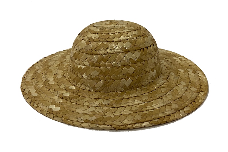 May include: A straw hat with a wide brim and a rounded crown. The hat is woven from natural straw and has a light brown colour.