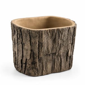 May include: A rectangular planter with a textured exterior that mimics the appearance of natural tree bark in shades of brown and gray. The interior of the container is smooth and light tan in color, featuring rounded corners and a wide opening.