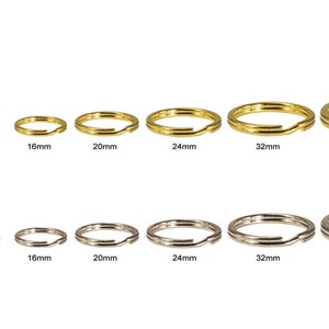May include: Assortment of gold and silver key rings in various sizes, ranging from 6mm to 38mm in diameter.