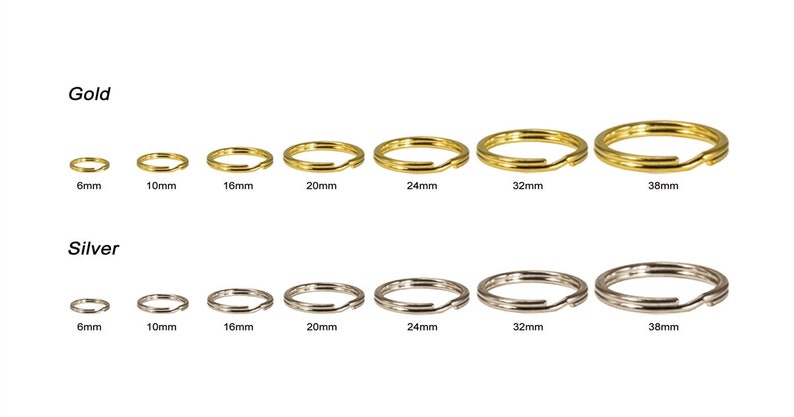 May include: Gold and silver split key rings in various sizes, ranging from 6mm to 38mm. The gold rings are displayed above the silver rings. The sizes are clearly labeled for each ring.