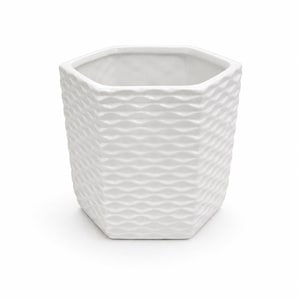 May include: A white, hexagonal ceramic planter with a textured, wave-like pattern. The planter is empty and sits on a white background. This decorative pot is suitable for indoor or outdoor use and is ideal for succulents or small plants.