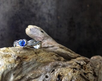Natural blue sapphire set in organic vine leaf silver ring