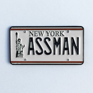 ASSMAN Enamel Pin imagem 1