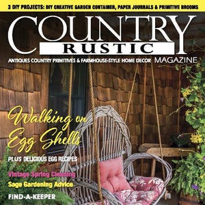 May include: A magazine cover featuring a rustic porch swing with a red and white floral cushion. The magazine is titled "Country Rustic" and the cover story is "Walking on Egg Shells".
