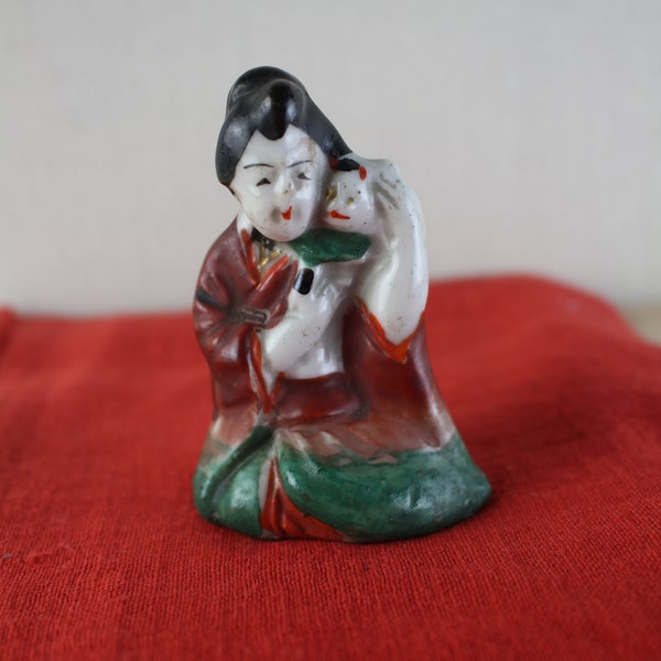 Japanese antique, a small porcelain doll calligraphy tool suiteki figurine.  It is a calligraphy tool suiteki from 1868 to 19011