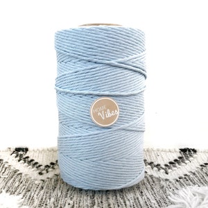 May include: A roll of light blue cotton rope with a brown label that says "Home Vibes".