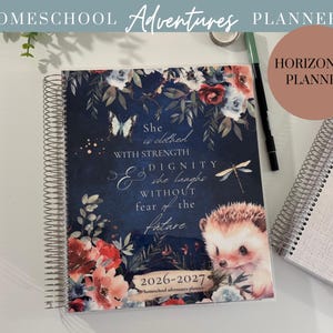 May include: A spiral-bound homeschool planner with a floral design and the text "She is clothed with strength & dignity she laughs without fear of the future." The planner features a hedgehog illustration and the years 2026-2027.