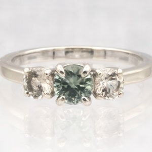 Montana Sapphire ring with Oregon Sunstone highlight stones!