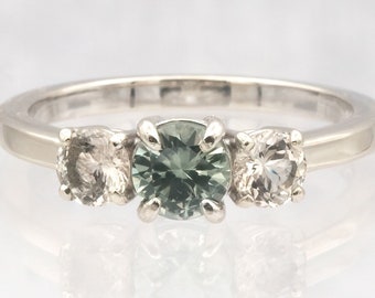Montana Sapphire ring with Oregon Sunstone highlight stones!