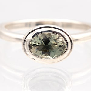 Oregon Sunstone dichroic oval set into sterling silver setting!