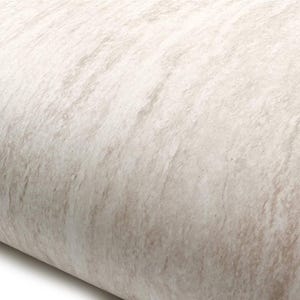 May include: Close-up of a roll of textured, off-white material with subtle brown veining. The surface has a natural, stone-like appearance, with a slight curve visible on the left side. The material appears to be smooth to the touch.