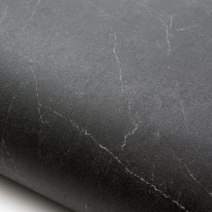 May include: Close-up of a dark grey, textured surface with subtle white veining. The material appears to be rolled, revealing its thickness and flexibility. The surface has a matte finish.