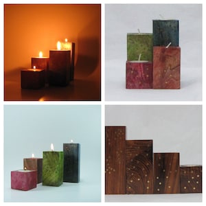 Peut inclure: Quatre bougeoirs en bois de différentes couleurs et tailles. Les bougeoirs sont disposés en forme de pyramide. Les bougeoirs sont en bois et ont une finition naturelle. Les bougeoirs sont parfaits pour ajouter une touche de charme rustique à n'importe quelle maison.