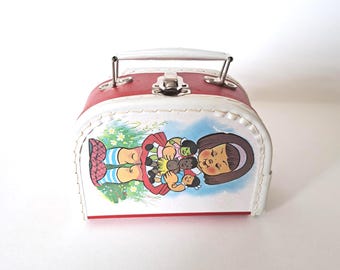 Vintage children's cardboard suitcase.