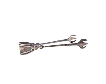 Vintage sugar tongs, silver plated.
