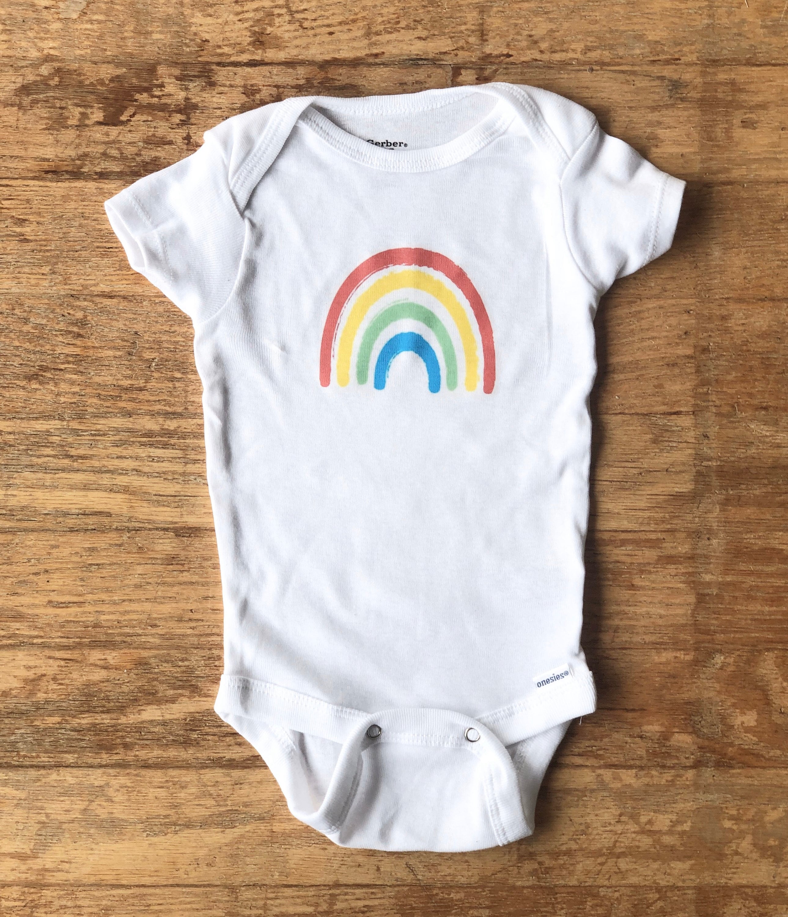 Organic Baby Gift Basket Rainbow moccasins, wooden toy, blanket, onesie