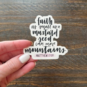 May include: White sticker with black text that reads "faith as small as a mustard seed can move mountains" with the scripture reference "Matthew 17:20" in smaller text below.