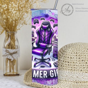 May include: A 20oz skinny tumbler featuring a purple and black gaming chair, controllers, and a gaming setup design. The tumbler has a stainless steel straw and is designed for sublimation. The text "GAMER GIRL" is at the bottom.