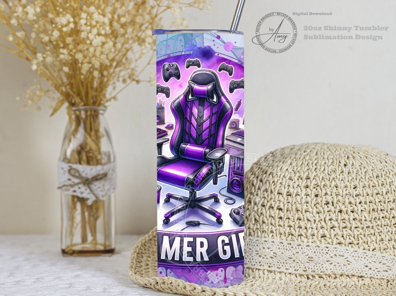 May include: A 20oz skinny tumbler featuring a purple and black gaming chair, controllers, and a gaming setup design. The tumbler has a stainless steel straw and is designed for sublimation. The text "GAMER GIRL" is at the bottom.