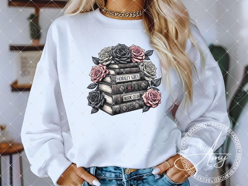 May include: White sweatshirt with a graphic of a stack of books with the text "Morally Grey Book Club" and floral accents.
