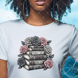 May include: A white t-shirt with a graphic design of a stack of books with the words "Morally Grey" and "Book Club" on the spines. The books are surrounded by black and pink roses.