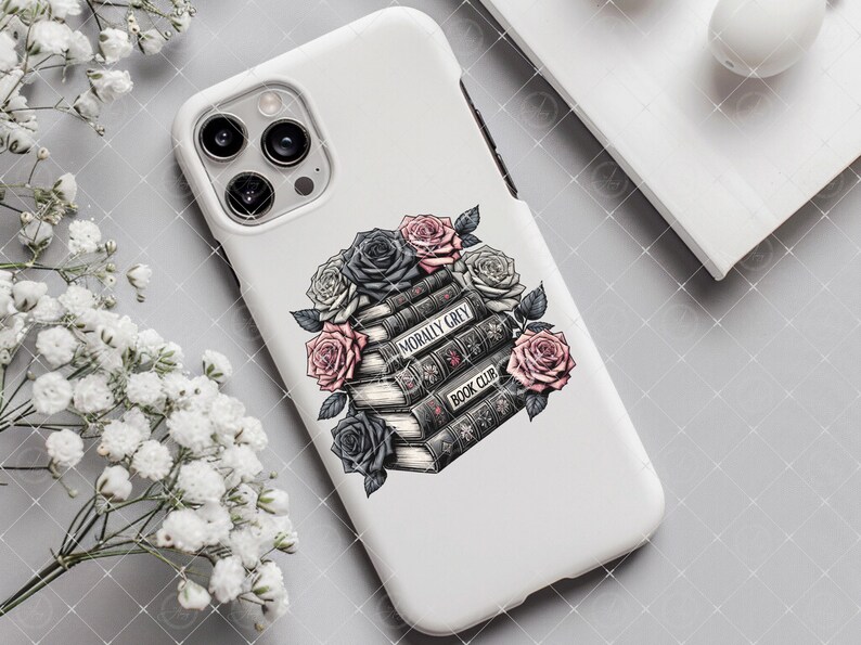 May include: White phone case with a stack of books and flowers. The books have the text "Morally Grey Book Club" on the spine. The flowers are black, white, and pink.