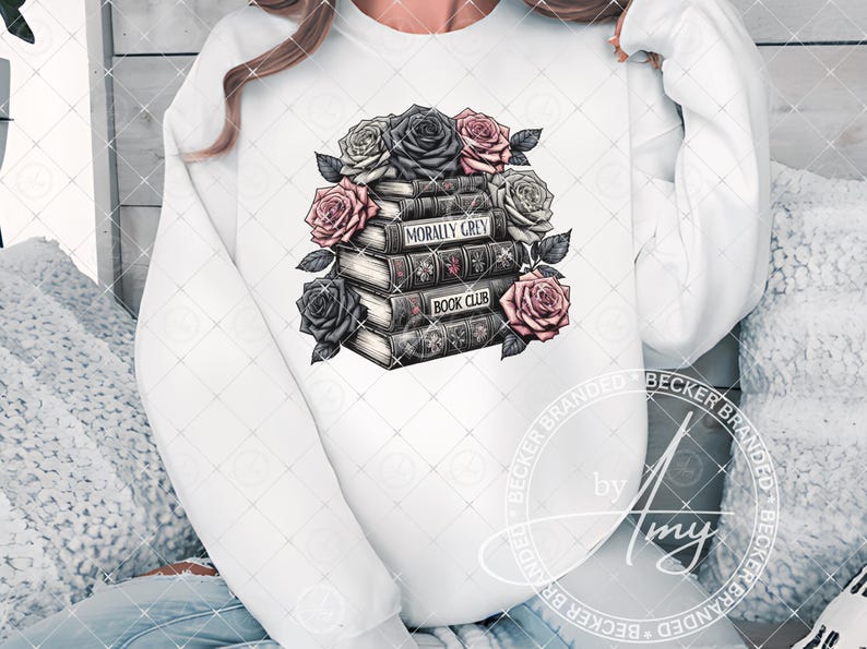 May include: White sweatshirt with a graphic of a stack of books with the text "Morally Grey Book Club" and pink and black roses.