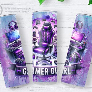 May include: A 20oz skinny tumbler with a sublimation design featuring a purple and blue watercolor design. The design includes a gaming chair, computer setup, headphones, and the words "Gamer Girl". The tumbler is decorated with game controllers.