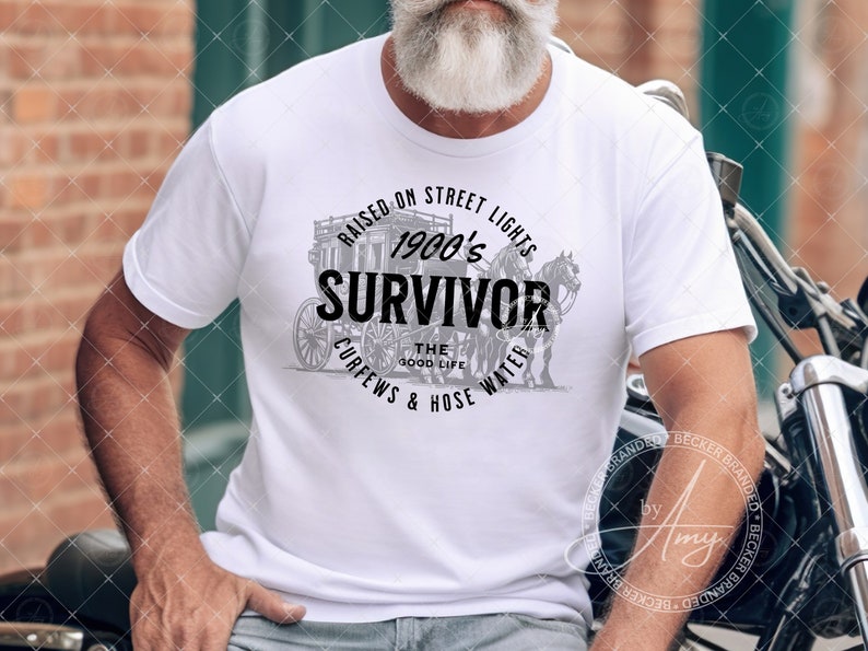 May include: A white t-shirt with a black and gray graphic design featuring a horse-drawn carriage and the text "Raised on Street Lights 1900's Survivor The Good Life Curfews & Hose Water".