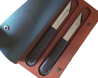 Set of TWO forged steak knives, asymmetrical blade. Leather handle, table knife, in leather case