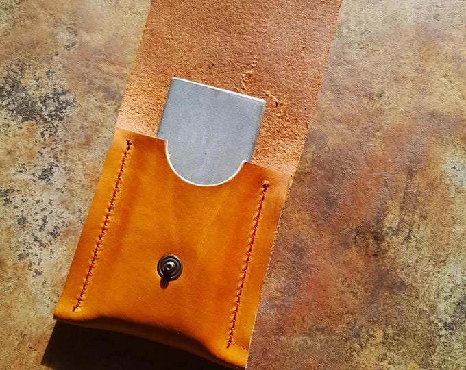 Natural knife sharpening stone in its leather case