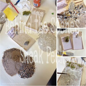 May include: A close-up of a miniature beach scene being created. The scene includes sand, rocks, and a small wooden walkway. The text "Behind the Scenes Sneak Peek" is visible in the image.