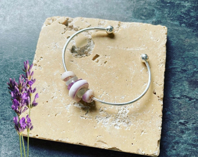Lavender Dreams. Hawaiian Puka Shells and Genuine Lavender Sea Glass on Sterling Silver Cuff Bangle. Guaranteed Authentic.